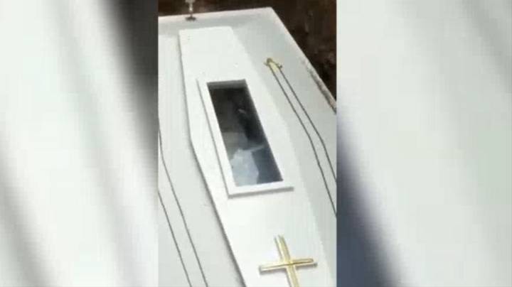 Video Captures Bizarre Moment Corpse Appears To Wave In Coffin