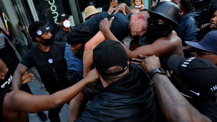 Man Who Carried Injured White Protester To Safety Breaks His Silence